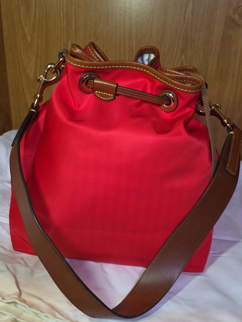 Dooney & Bourke Red Drawstring Bucket Bag with Brown Trim